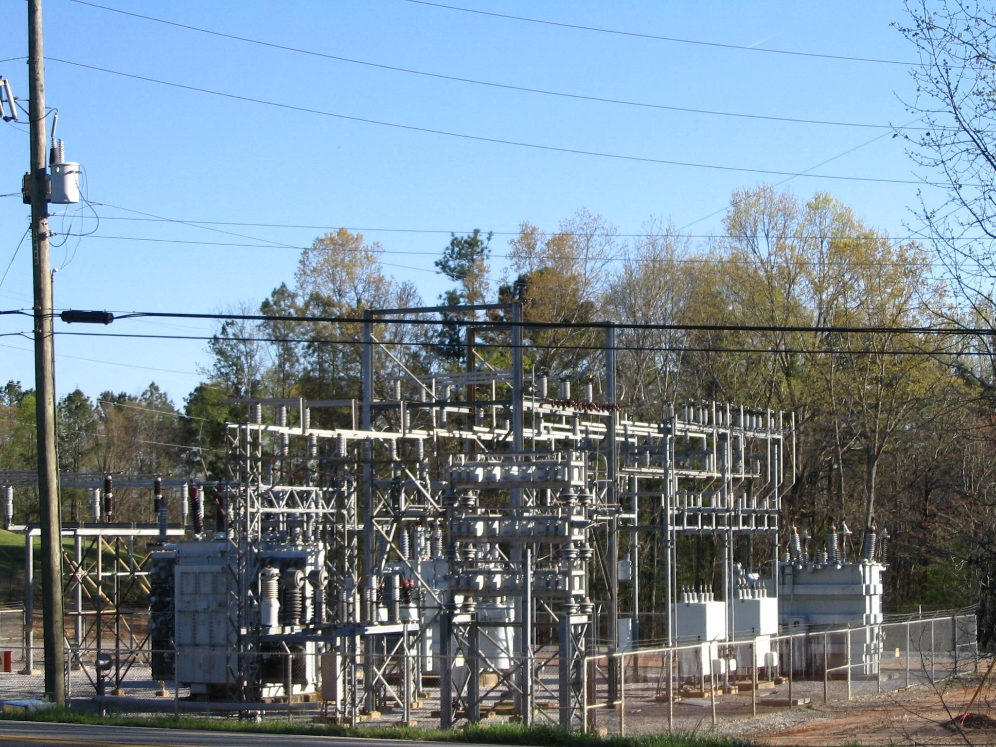 Electrical workers in industrial environment